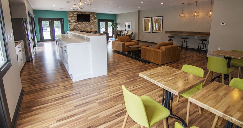 a living room with a kitchen and a dining room