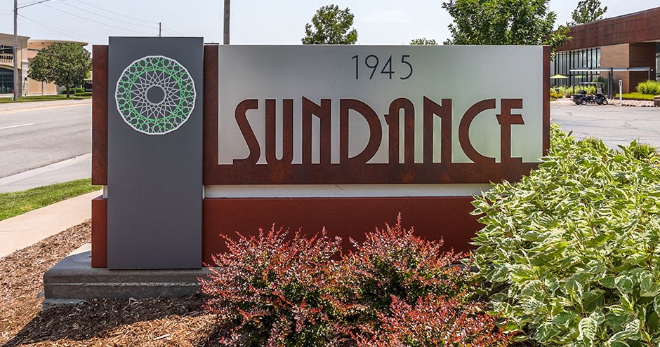 a sign for the sunningdale sign in front of a building