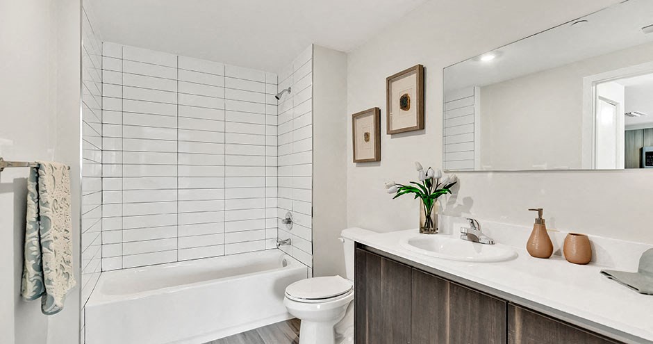 a bathroom with a sink toilet and a bath tub