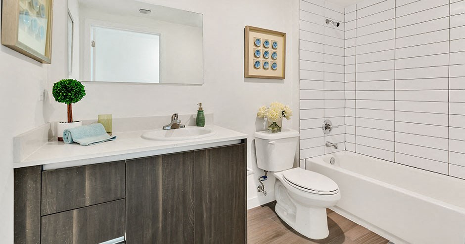 a bathroom with a sink toilet and a bath tub