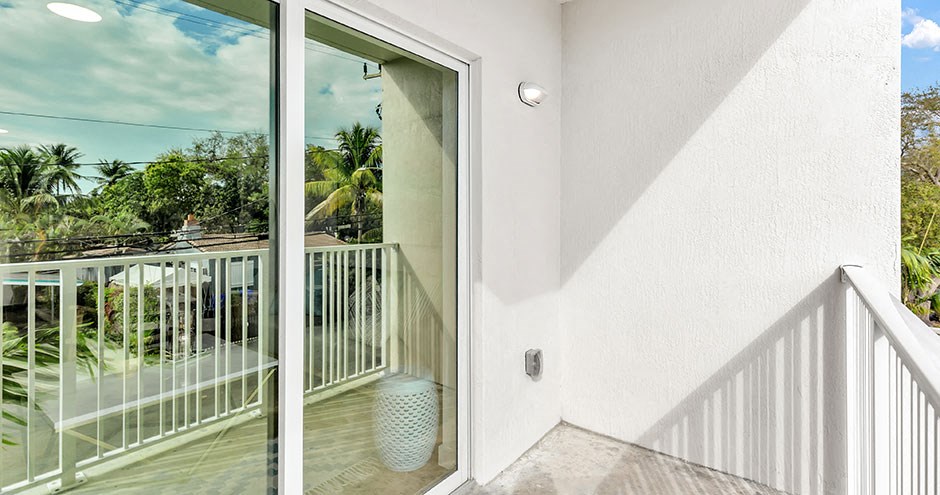 a view of the balcony from the top of the stairs