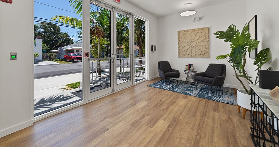 a living room with a sliding glass door to a street