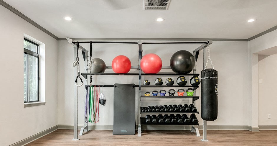 the gym at the flats at big tex apartments