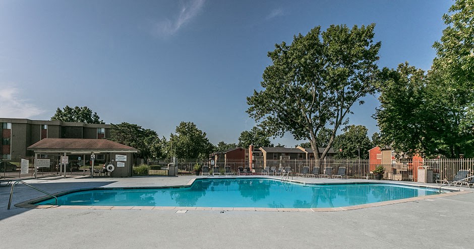 a swimming pool with a fence around it