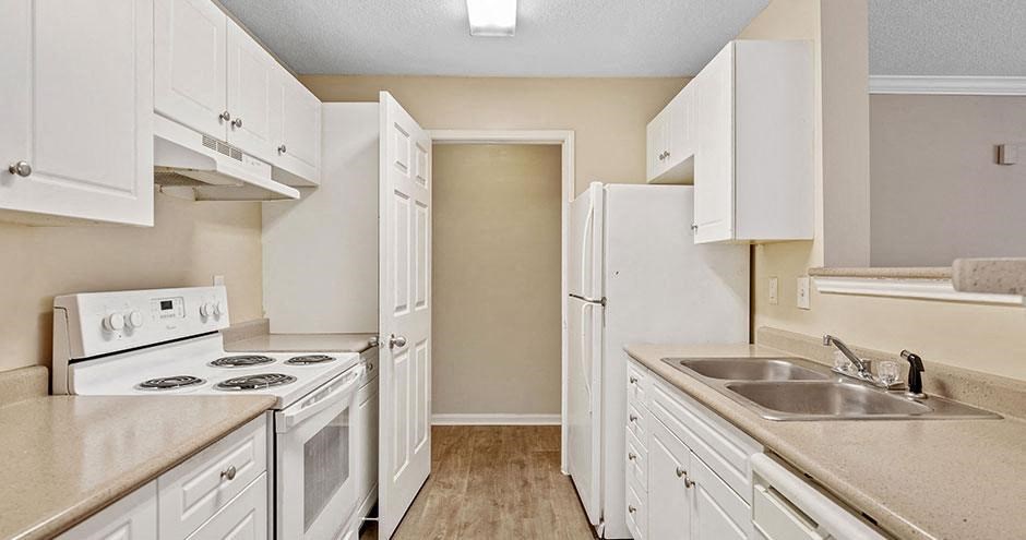 a kitchen with a stove and a sink
