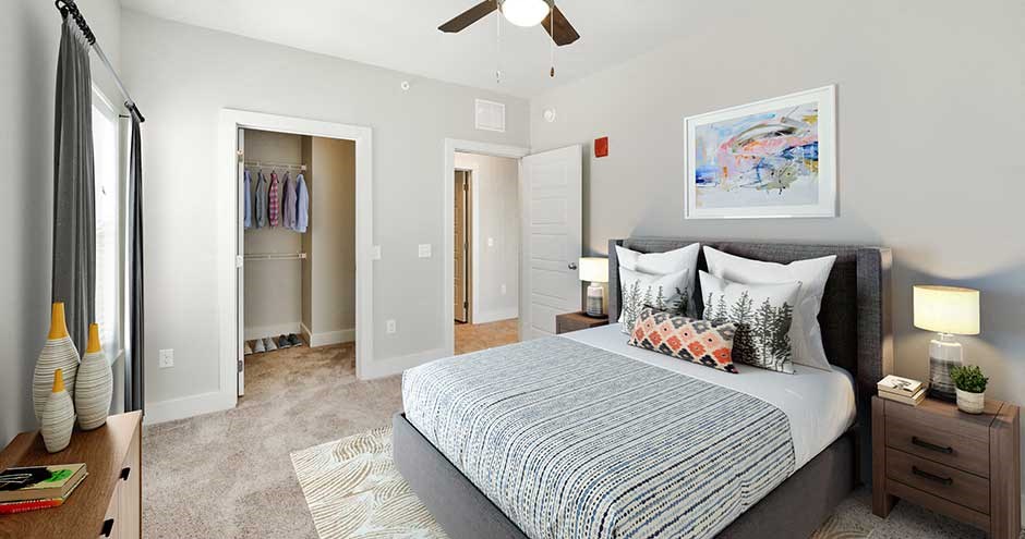 a bedroom with a bed and a closet