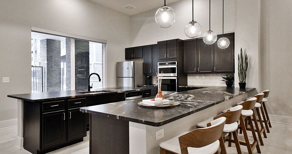 a large kitchen with a large island and chairs