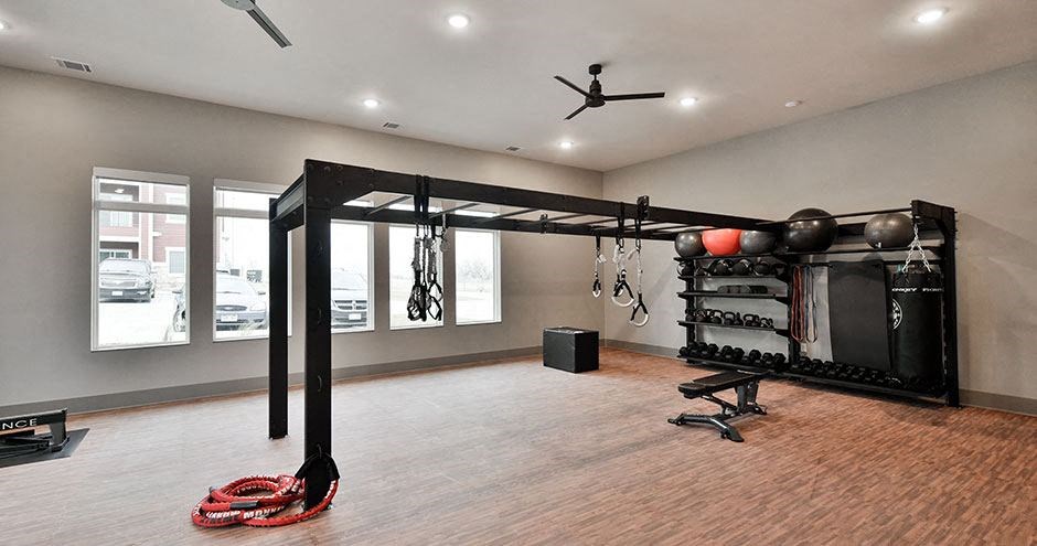 a workout room with a boxing gym and a large window