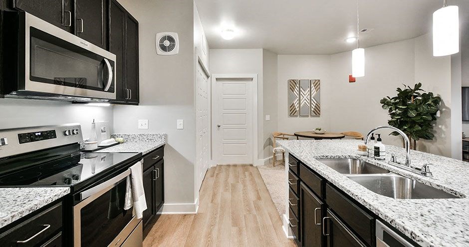 a kitchen with a sink and a microwave