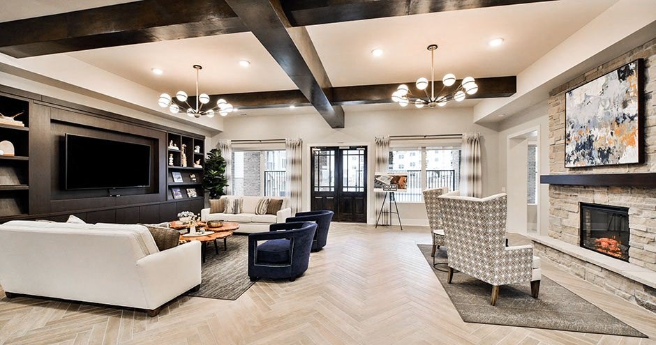 a living room with a fireplace and a tv
