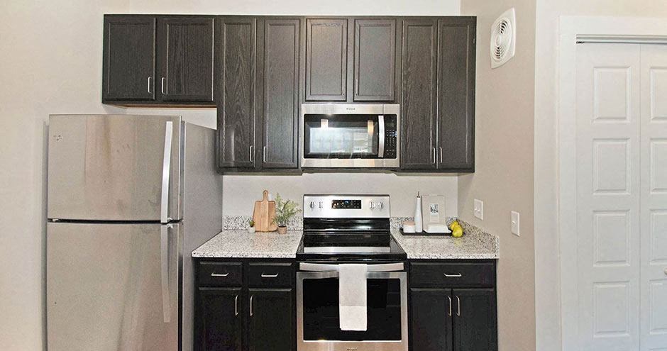 a kitchen with a stove and a refrigerator