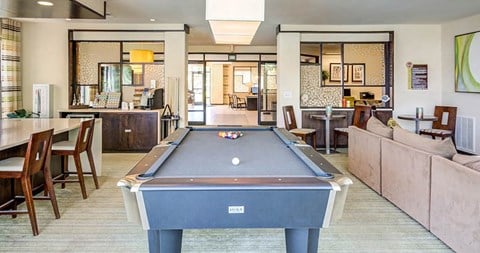 a living room with a pool table