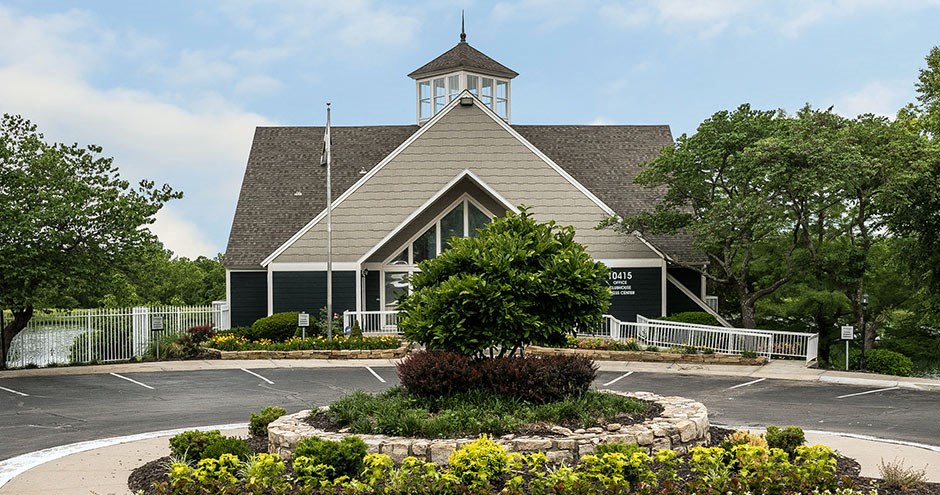 the front of a church with a parking lot