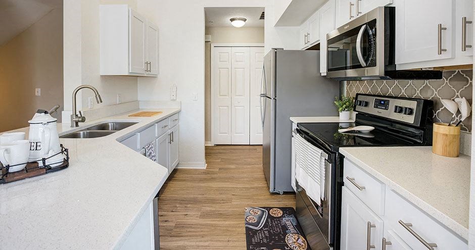 a kitchen with a stove and a refrigerator