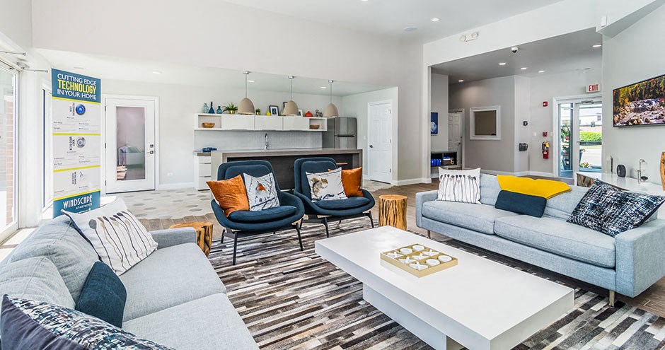 a living room with couches and chairs and a coffee table