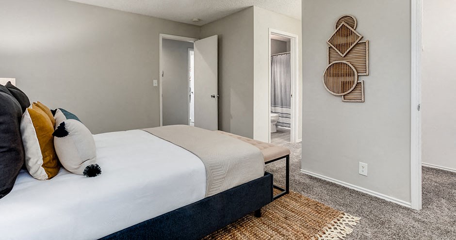 a bedroom with a bed and a closet