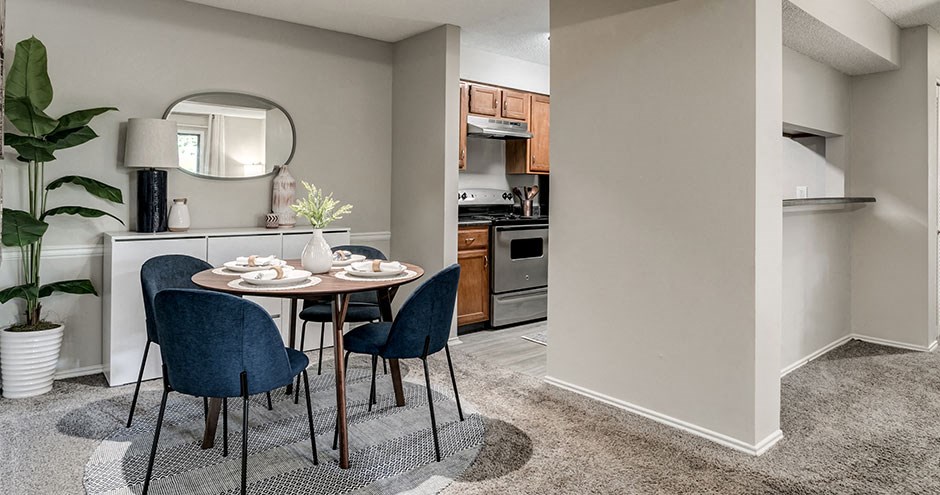 an open kitchen and dining area with a table and chairs