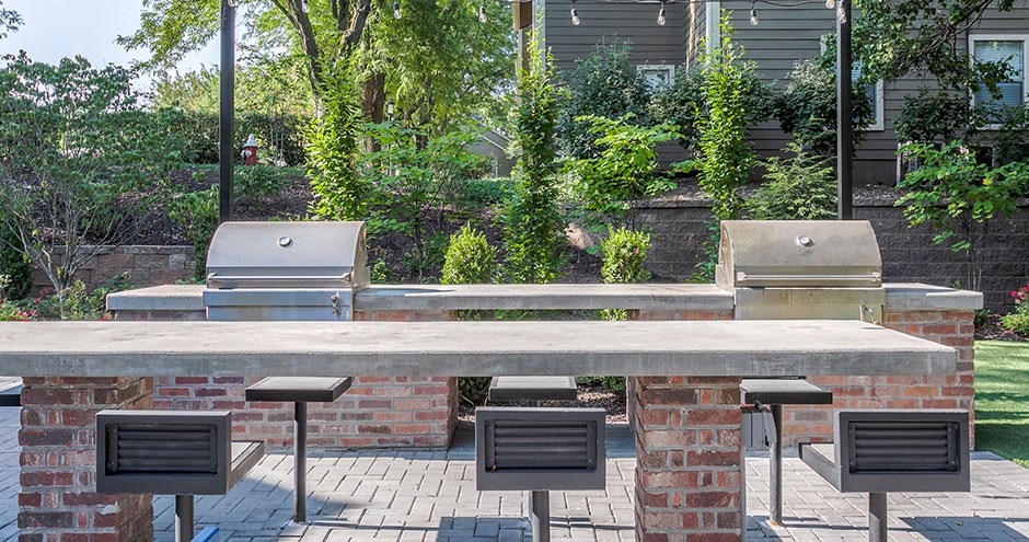 a picnic area with a brick table and benches