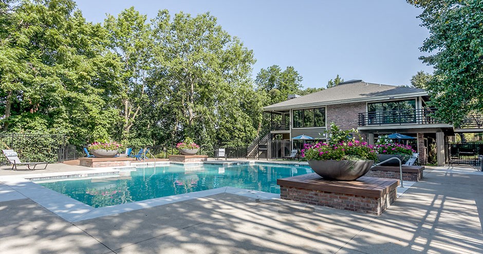 a swimming pool in front of a house