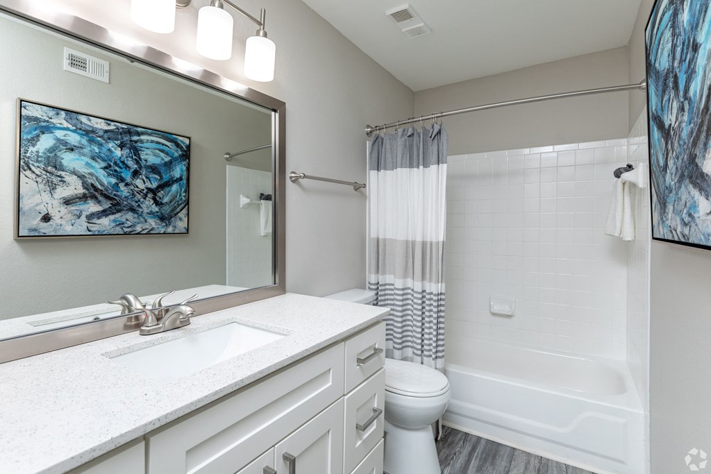 a bathroom with a bathtub and a toilet