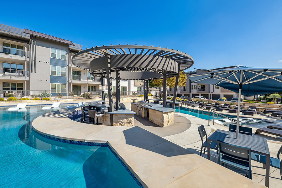 the Domain apartments - The Addison Apartments Poolside lounge with ample seating