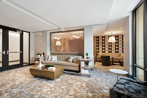 A modern living room with a large sofa and a coffee table.