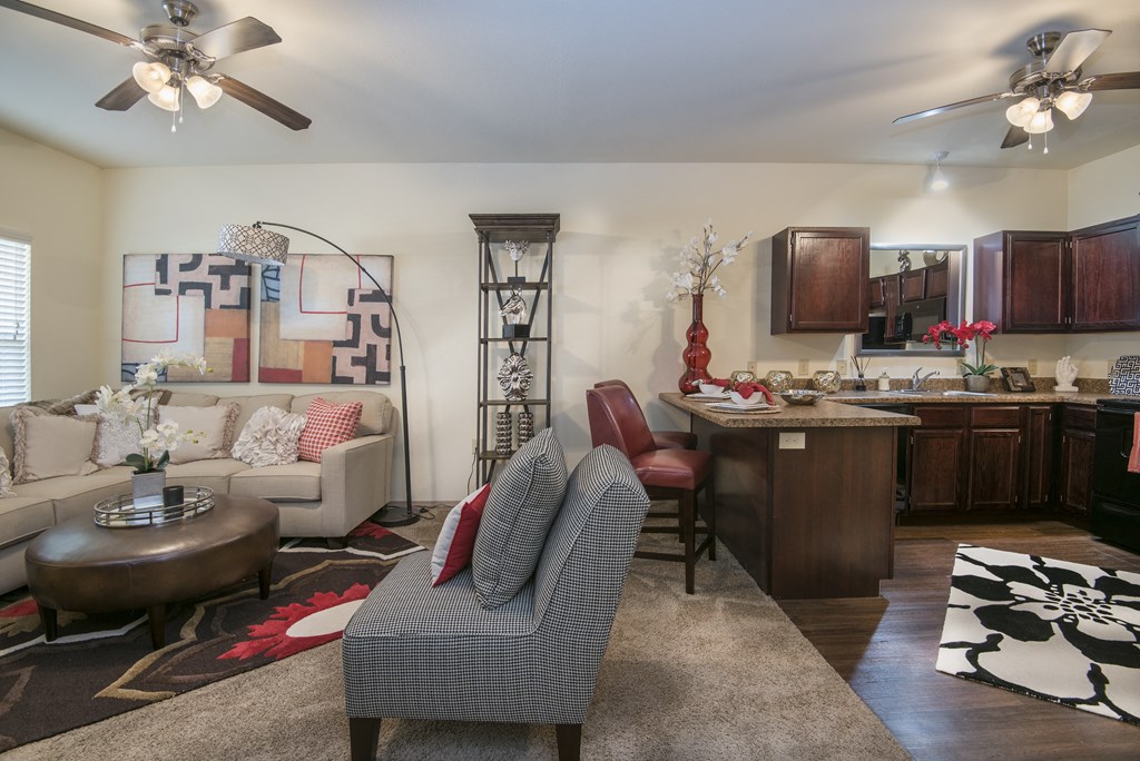 A living room with a grey armchair and a coffee table.