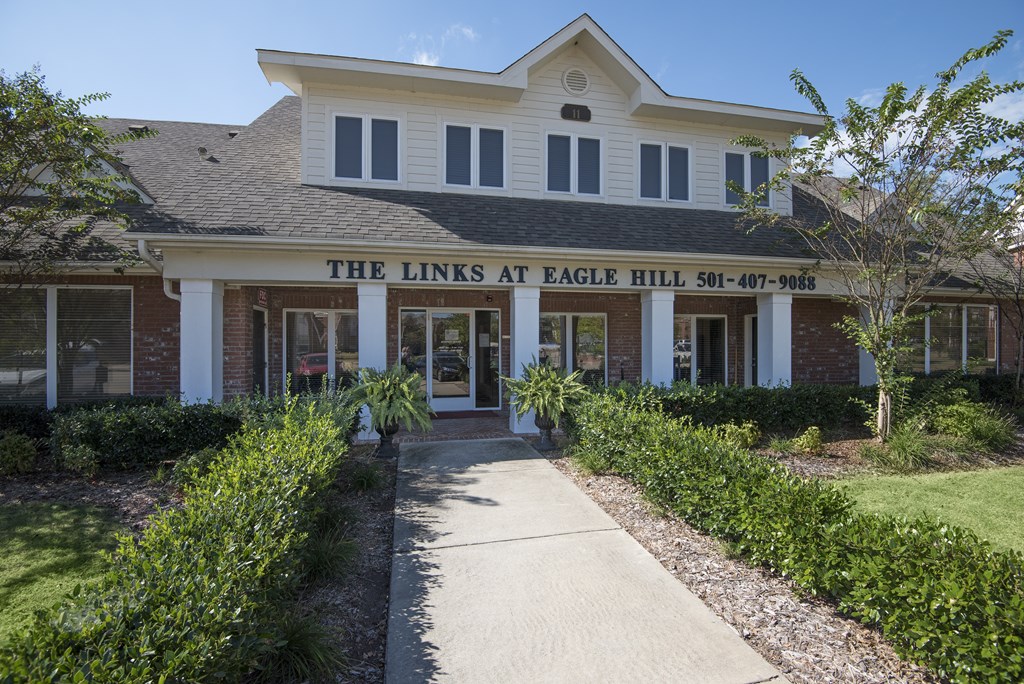 The front of a building with the name "The Links at Eagle Hill" on it.