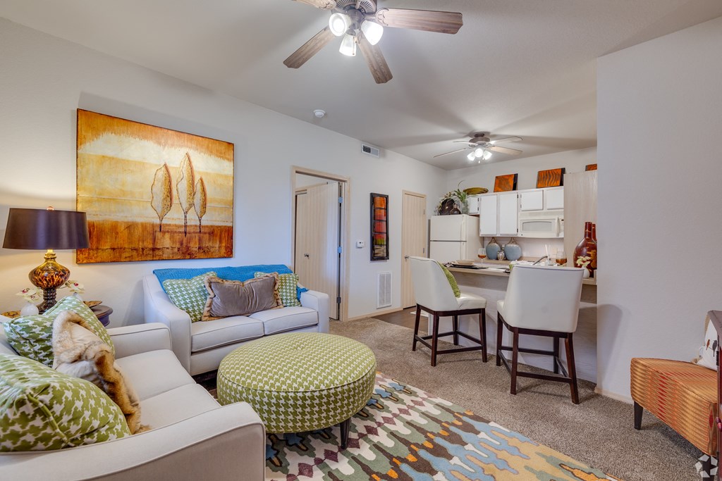a living room and dining room with a couch and a table