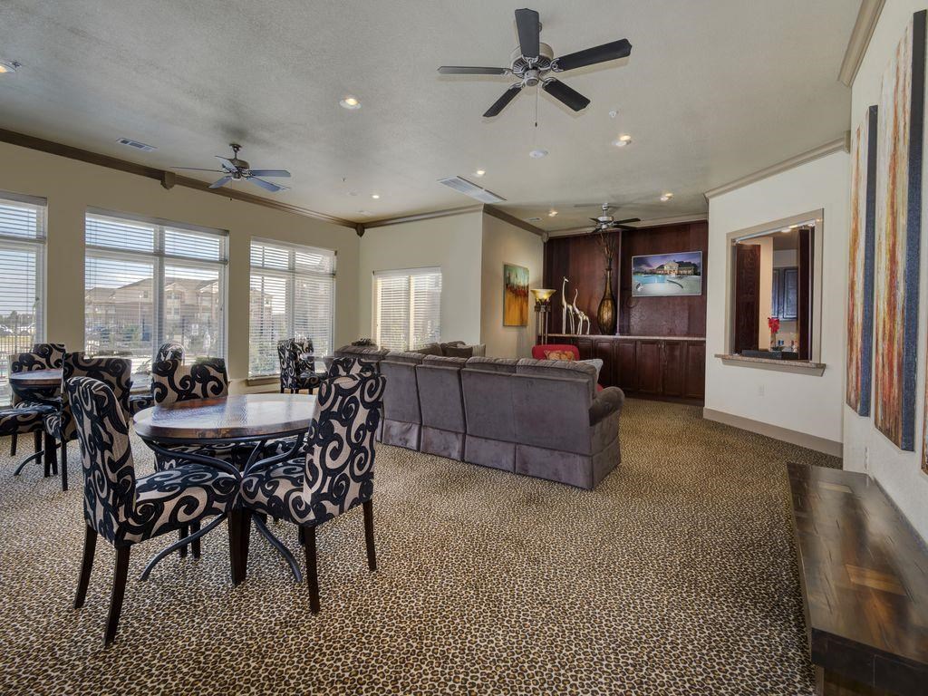 a living room with a couch and a dining table
