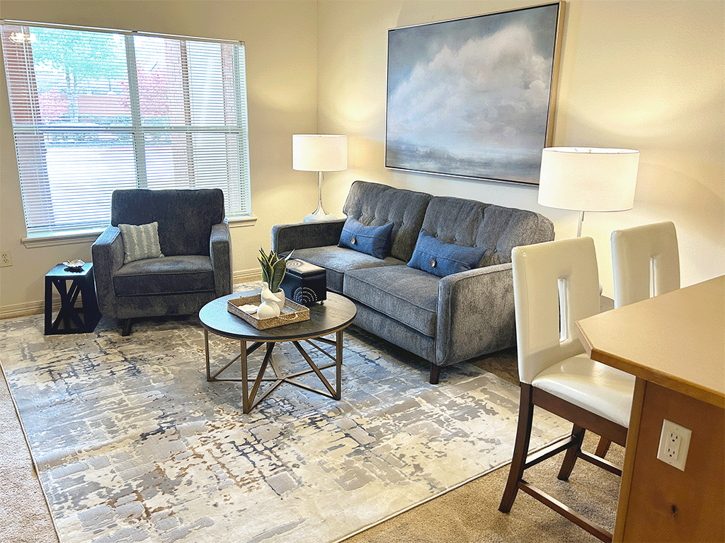 a living room with a couch and a table