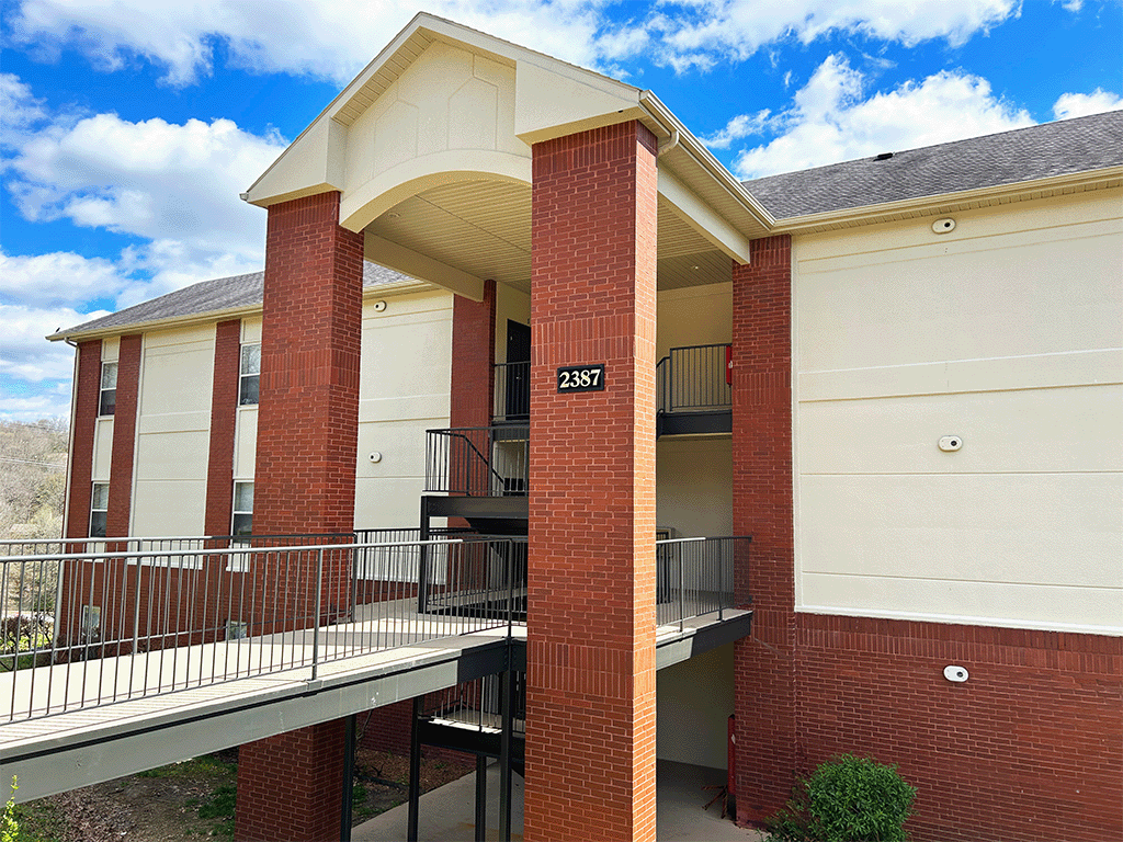 an exterior view of a building with balconies