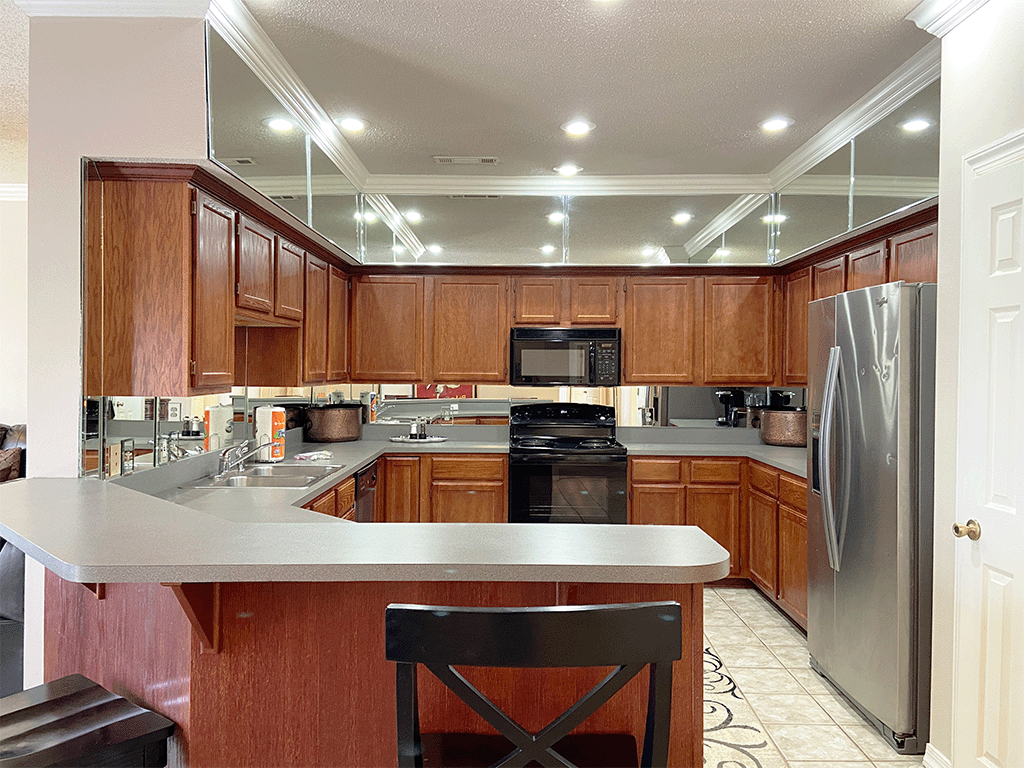 a kitchen with wooden cabinets and a counter top