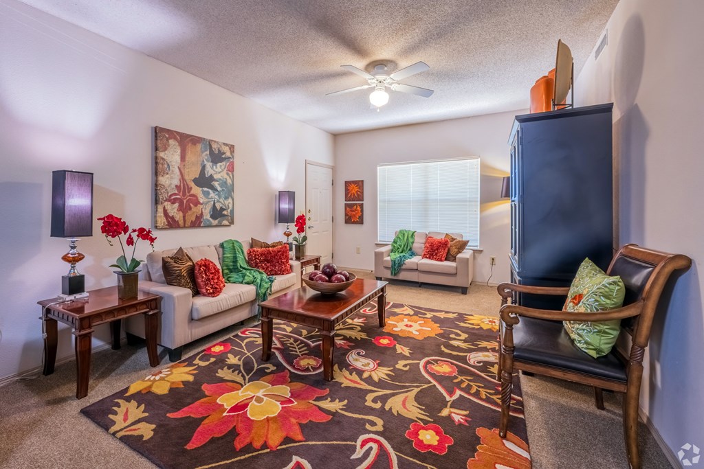 a living room with couches and a tv
