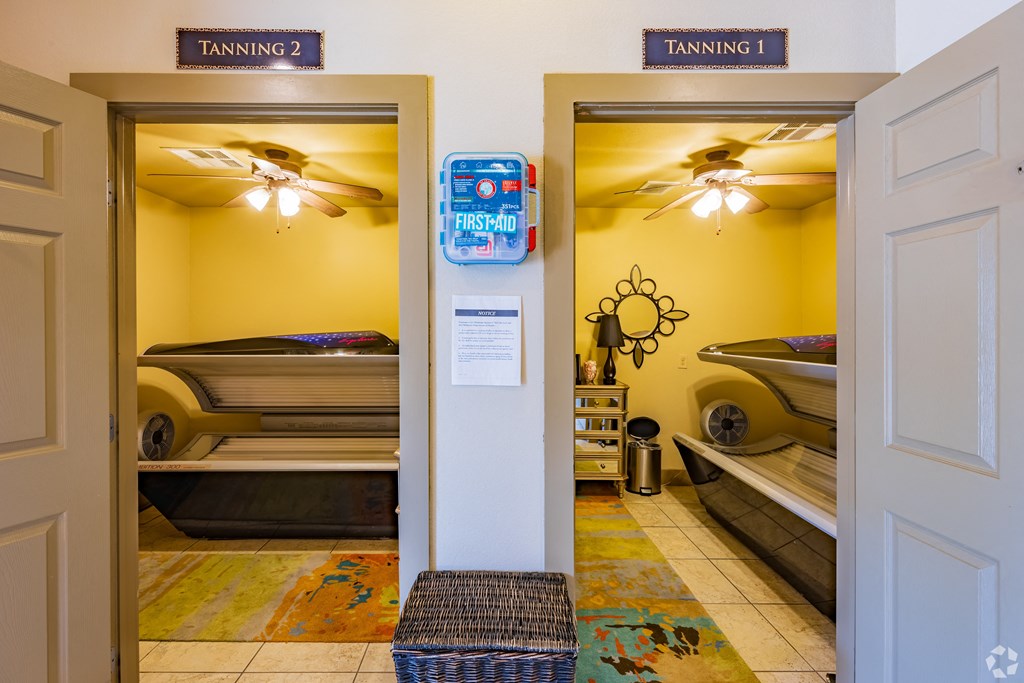 a bedroom with two bunk beds and a doorway to a room with bunk beds