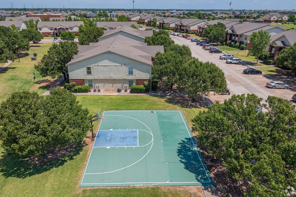 a basketball court in front of a house