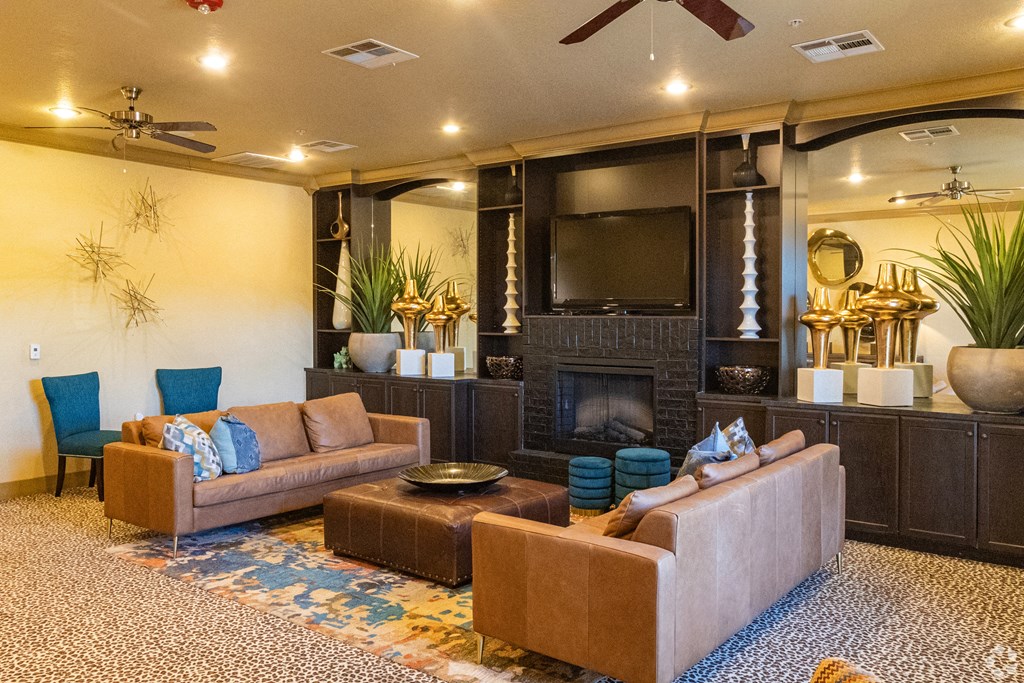 a living room with couches and a fireplace