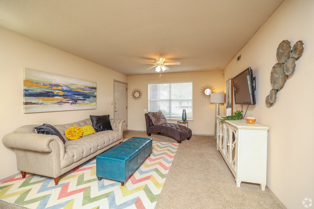 a living room with a couch and a and a tv