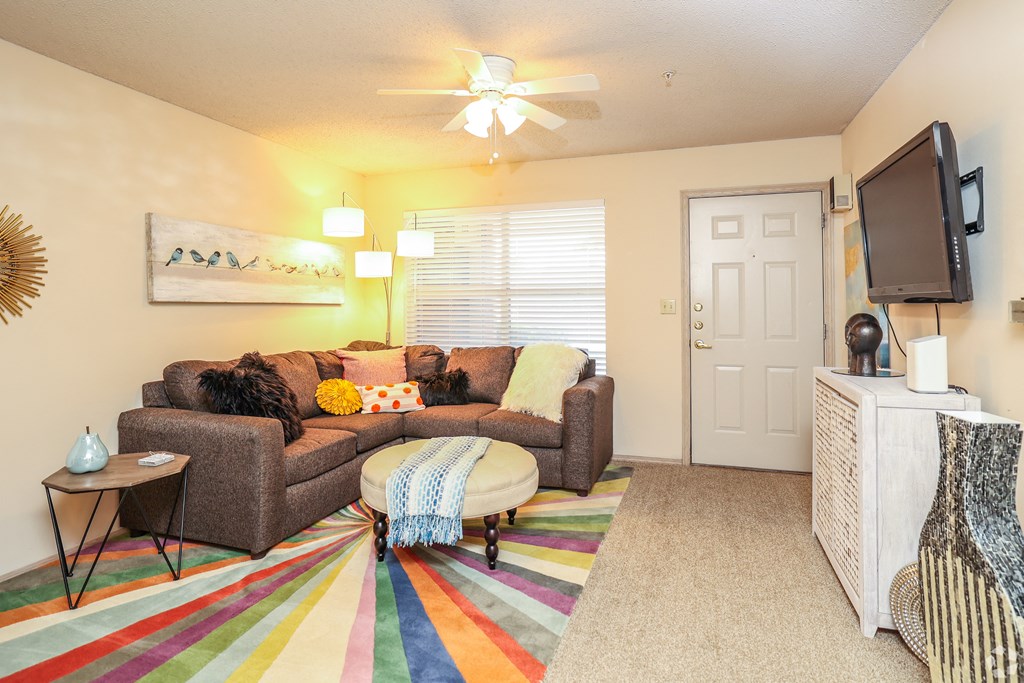 a living room with a couch and a tv