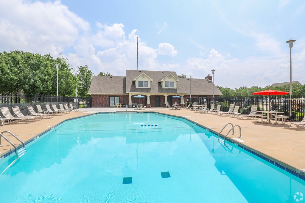 the swimming pool at the falls at rolland park apartments in