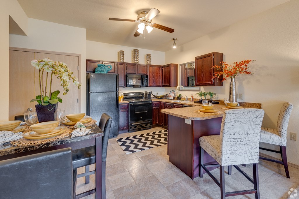 a kitchen and dining area with a dining table and chairs