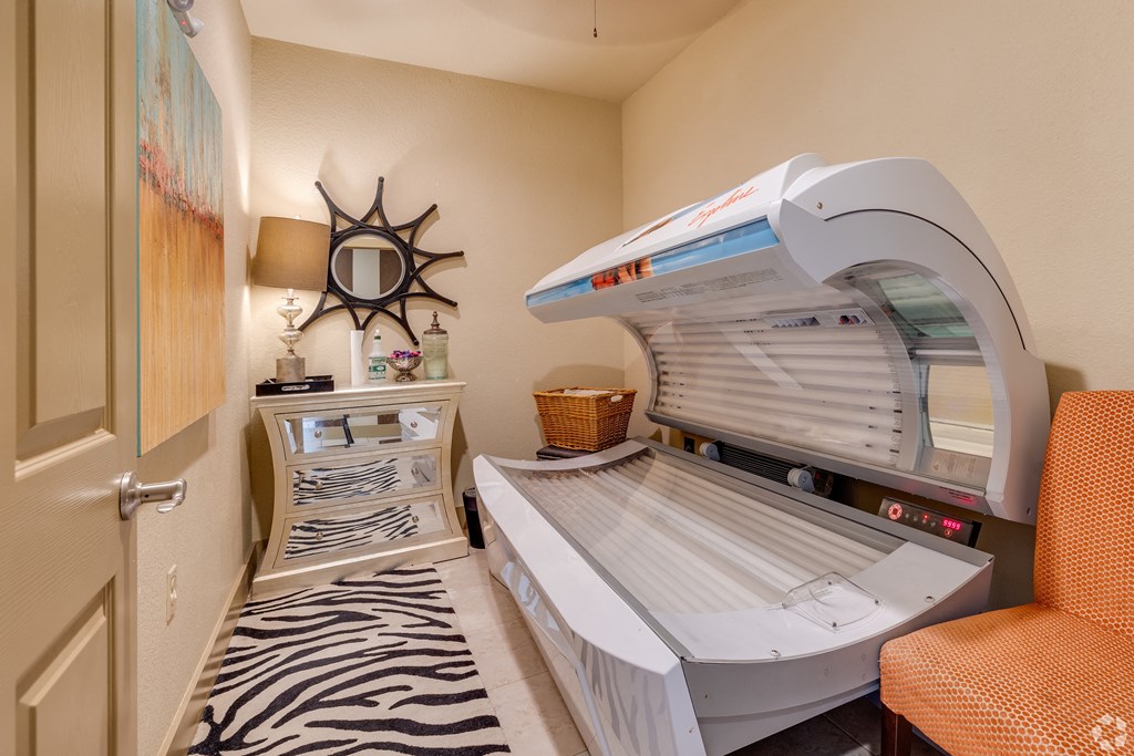 an infrared sauna in a room with a chair and a table