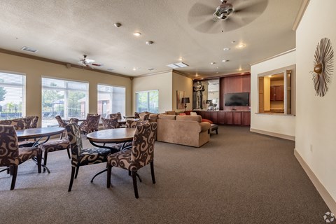 a living room with a table and chairs and a couch