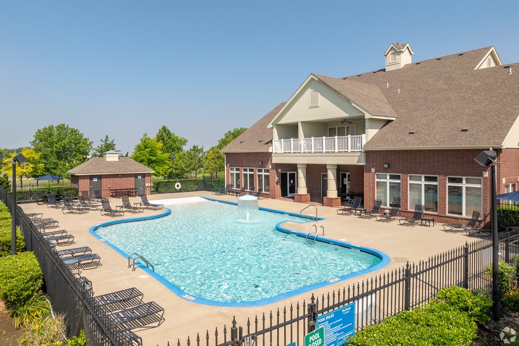 our resort style swimming pool is in front of our house with lounge chairs