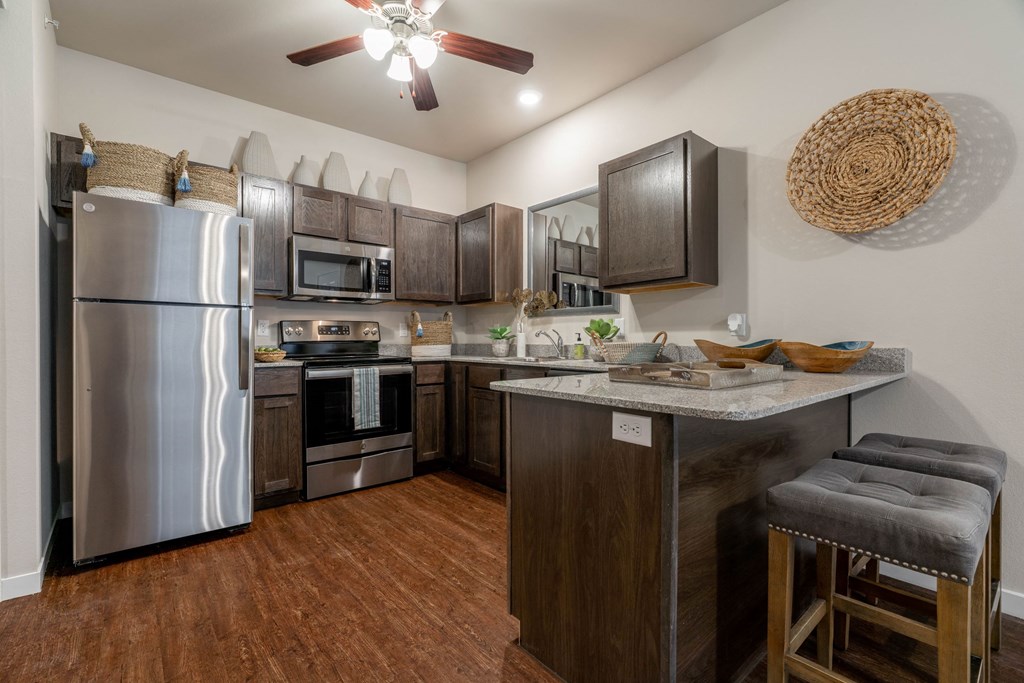 a kitchen with stainless steel appliances and a counter top