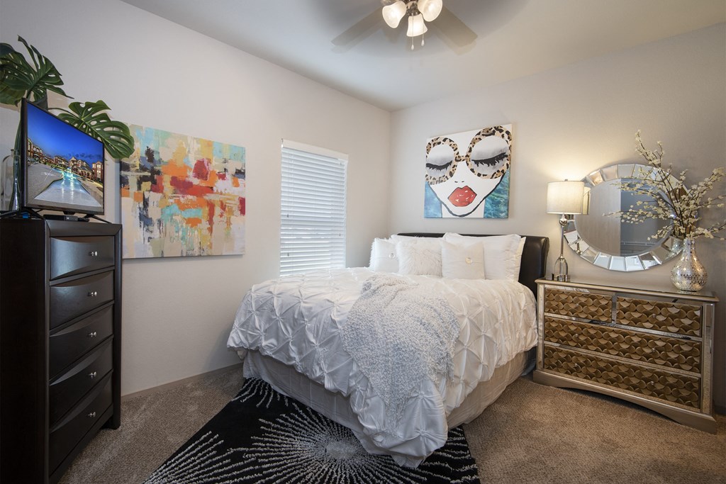 view of bedroom with bed and dresser and tv at the preserve at greatstone