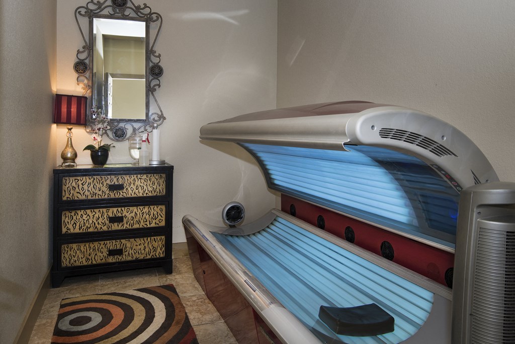 a small room with a tanning bed