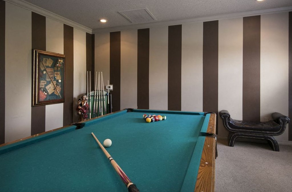 a pool table in a room with a ball