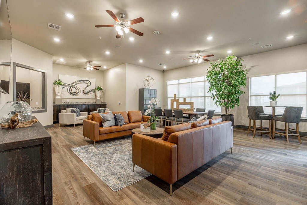 a living room with couches and chairs and a fireplace