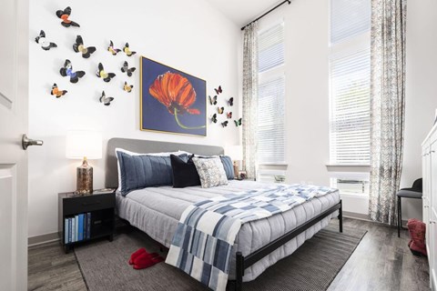 Apartment bedroom at Anchor with modern furnishings and decorative wall artwork